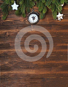 Christmas mockup with fir tree branches and white decorations on the wooden background