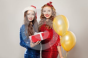 Christmas models with red gift box on white background