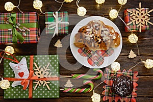 Christmas morning table with croissant and gifts. Top view