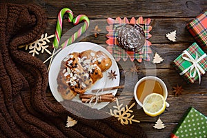 Christmas morning table with croissant and gifts. Top view