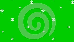Christmas motion background. It is snowing. Isolated snowfall on green background.