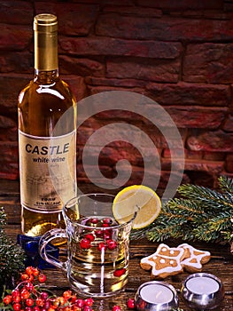 Christmas mug decoration lemon slice and bottle wine.