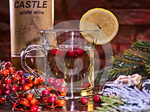 Christmas mug decoration lemon slice on bottle wine background.