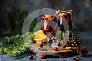 Christmas mulled red wine with spices, cranberry and fruits. Traditional Christmas hot drink. Christmas drink background