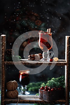 Christmas mulled red wine with spices, cranberry and fruits. Traditional Christmas hot drink. Christmas drink background