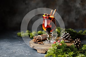 Christmas mulled red wine with spices, cranberry and fruits. Traditional Christmas hot drink. Christmas drink background