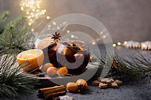 Christmas mulled wine  in circle glasses delicious holiday like parties with orange cinnamon star anise spices. Traditional hot