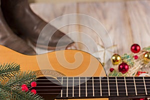 christmas music background with acoustic guitar and holiday decoration