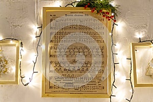 Christmas Music sheet with notes Christmas lights and tree
