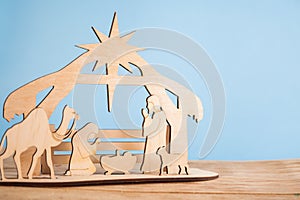 Christmas Nativity Scene of baby Jesus in the manger with Mary and Joseph in silhouette surrounded by the animals