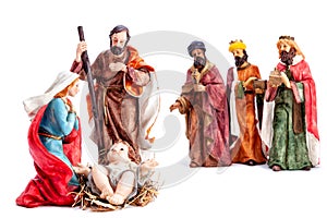 Christmas nativity scene with the Holy Family and the three wise men, isolated on white background