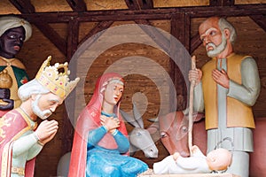 Christmas nativity scene with baby Jesus, Mary and Joseph in barn.