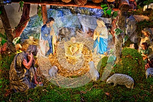 Christmas nativity scene with baby Jesus, Mary & Joseph in barn