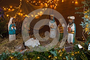 Christmas nativity scene with baby Jesus, Mary and three kings in barn