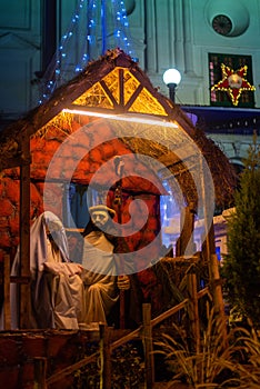 Christmas Nativity scene on display at night with lights