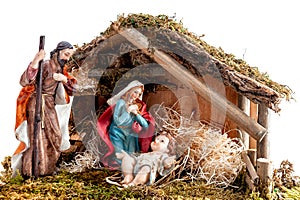 Christmas nativity scene with Holy Family in the hut, isolated on white background