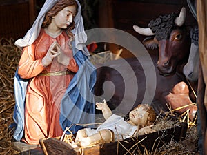 Christmas. Nativity scene with life size statues and baby Jesus