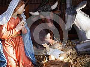 Christmas. Nativity scene with life size statues and baby Jesus