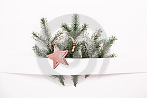 Christmas Neutral floral composition of fir branches and wooden star baubles