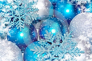 Christmas and New Year background. blue and silver sparkling balls, snowflake ornaments