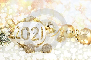 Christmas and New Year background with bokeh lights and decorations, toys with fir branches in snow flakes, place for text.