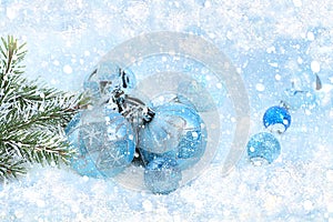 Christmas and New Year background with bokeh lights and decorations, toys with fir branches in snow flakes, place for text.