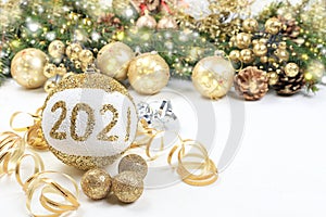 Christmas and New Year background with bokeh lights and decorations, toys with fir branches in snow flakes, place for text.