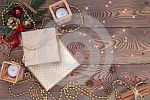 Christmas or new year background, composition of christmas decorations and fir branches, gifts wrapped in paper, candles
