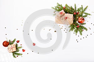 Christmas or New Year background, composition made of red Xmas decorations, gifts and fir branches on white background