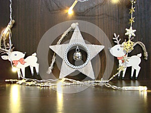 Christmas and New year background with empty dark wooden deck table over christmas tree and blurred light