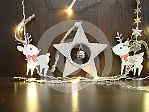 Christmas and New year background with empty dark wooden deck table over christmas tree and blurred light