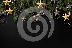 Christmas and New Year background with fir branches, golden and black baubles and stars on black background