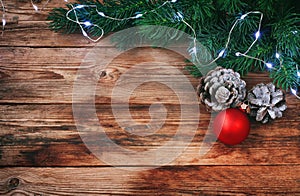 Christmas, new year background, fir branches, light garland and red ball