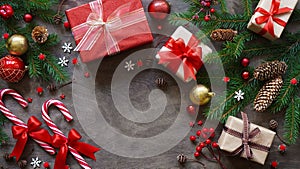 Christmas or new year background,simple composition of christmas decoration gift boxes,balls,cones,lollipops and fir branches on