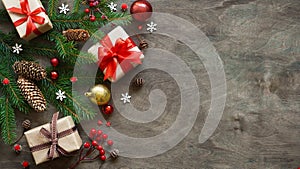 Christmas or new year background,simple composition of christmas decoration gift boxes,balls,cones,snowflakes and fir branches on
