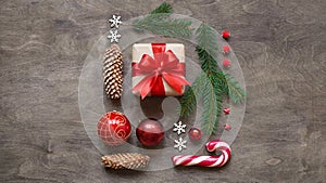 Christmas or new year background,simple composition of christmas decoration gift boxes,red balls,cones, snowflakes,lollipops and