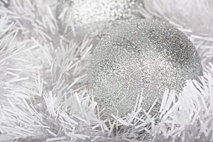 Christmas and New Year background of white garlands and silver ball