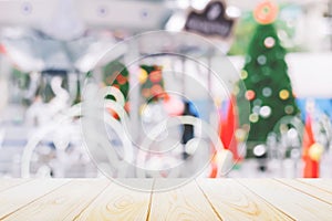 Christmas and New year background,Wood table top with blurred decoration chrismas tree and bokeh background