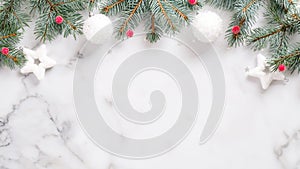 Christmas or New year banner. Pine tree branches, red berry, white balls on marble background top virew. Christmas, New Year,