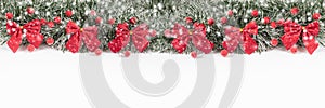 Christmas and New Year banner with red bows and berries on a white background. Christmas composition with copy space