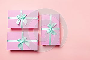 Christmas New Year birthday valentine celebration present romantic concept. Three pink gift boxex isolated on pink background