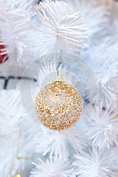 Christmas or New Year card, white Christmas tree and golden ball decoration. Bright Holiday background