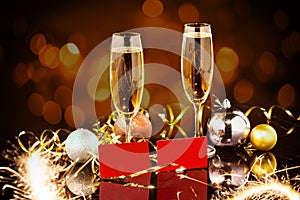 Christmas and New Year celebration with champagne. New Year holiday decorated table. Two Champagne Glasses