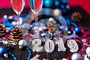 Christmas and New Year celebration with champagne. New Year holiday decorated table. Two Champagne Glasses