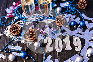 Christmas and New Year celebration with champagne. New Year holiday decorated table. Two Champagne Glasses