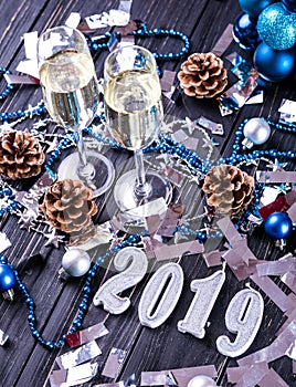 Christmas and New Year celebration with champagne. New Year holiday decorated table. Two Champagne Glasses