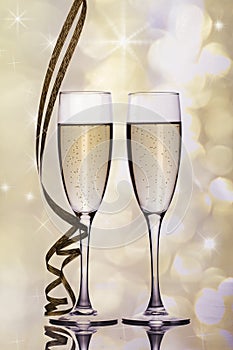 Christmas and New Year celebration with champagne. New Year holiday decorated table. Two Champagne Glasses