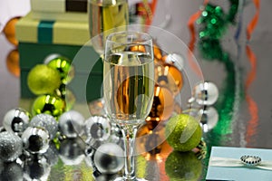Christmas and New Year celebration with champagne. New Year holiday decorated table. Two Champagne Glasses, vintage toned