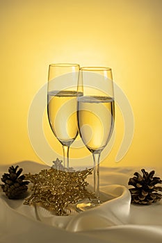 Christmas and New Year celebration with champagne. Two Champagne Glasses with Christmas decor