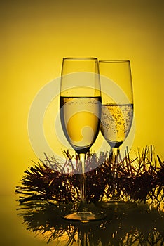 Christmas and New Year celebration with champagne. Two Champagne Glasses with Christmas decor